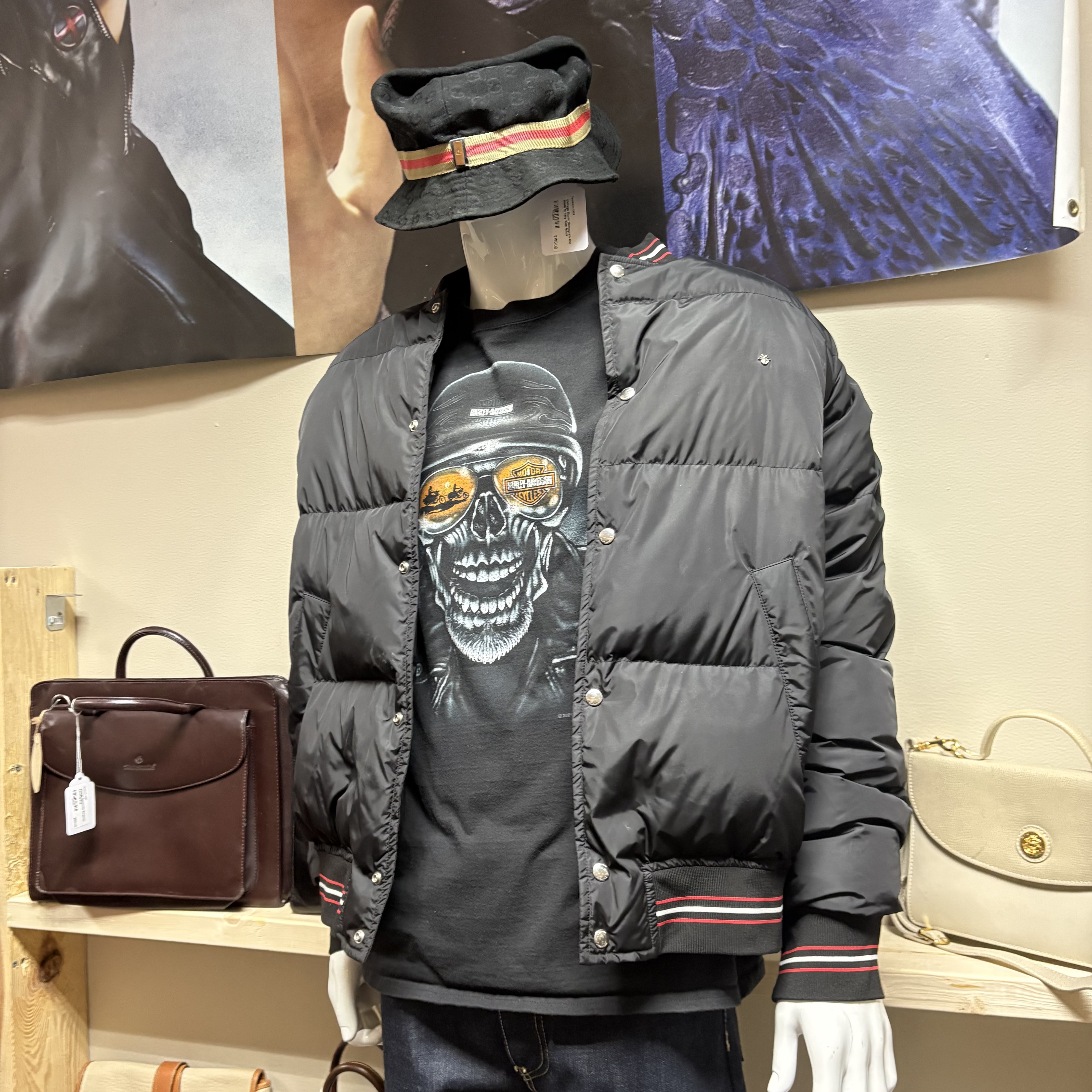 Vintage mannequin outfit and bags on display